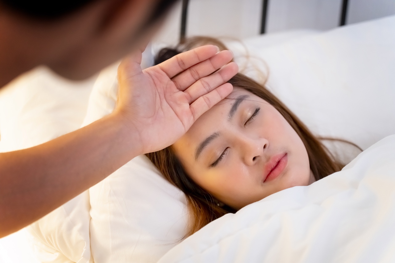 Zieke vrouw met koorts